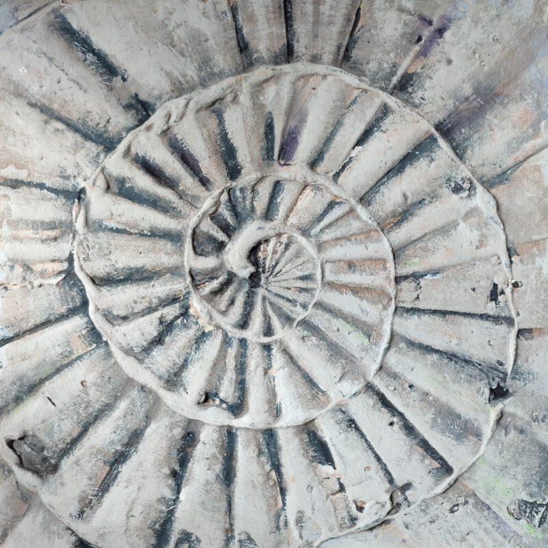 An abstract painting of a grey shell, using incorporated ash.