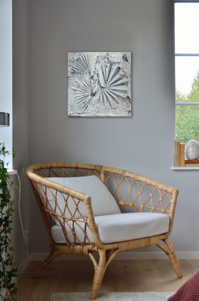 The grey shell painting on a wall.