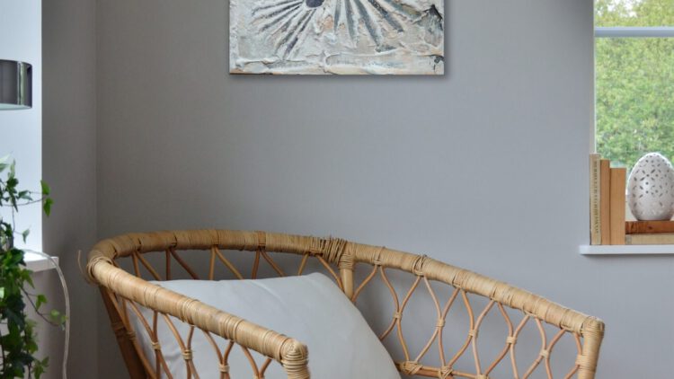 The grey shell painting on a wall.